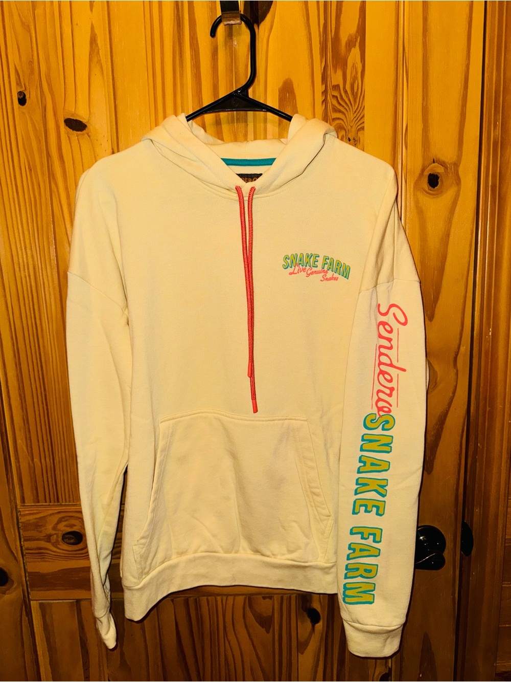 Snake Farm Cream Hoodie with Pink & Teal Sleeve Script
